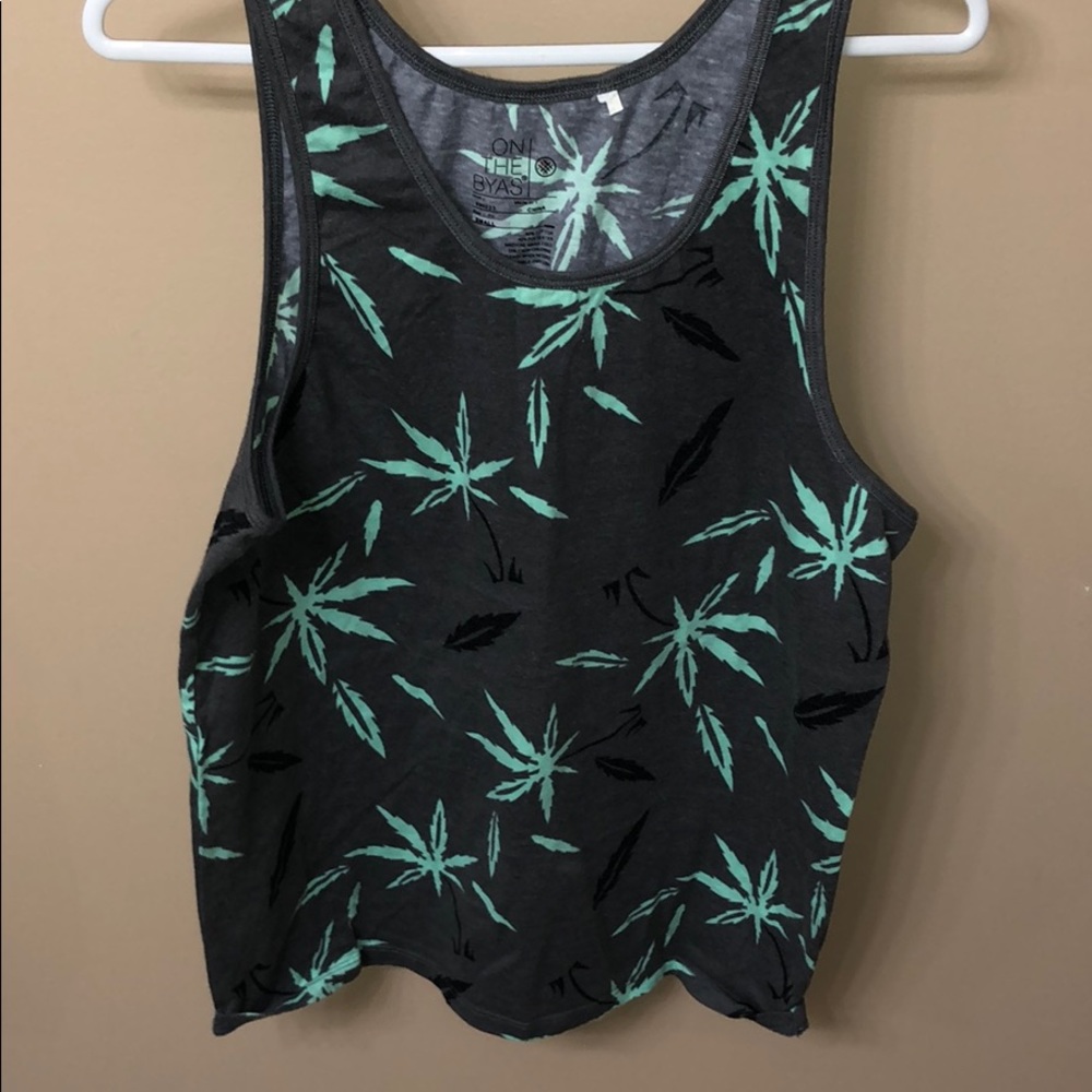 On The Byas gray tanks with teal & black leaves